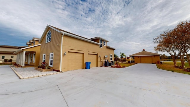 view of side of property featuring a garage