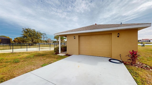 garage with a yard