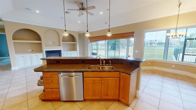 kitchen featuring a center island with sink, built in features, dishwasher, pendant lighting, and sink