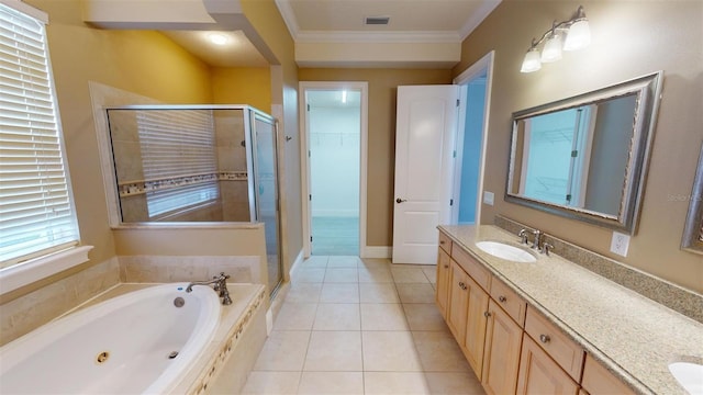 bathroom featuring tile patterned floors, vanity, ornamental molding, and shower with separate bathtub