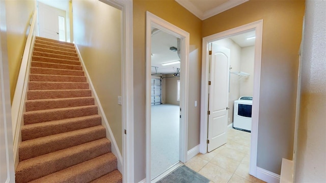 stairway with washer / dryer, ornamental molding, and tile patterned flooring