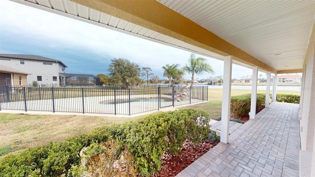 view of swimming pool with a lawn and a patio