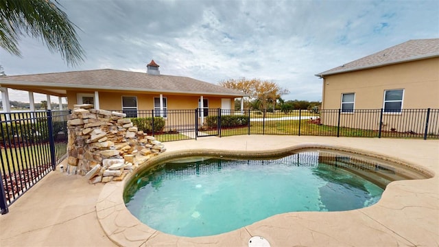 view of swimming pool featuring a patio