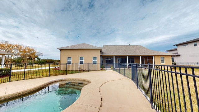 view of pool with a patio area, a sunroom, and a yard