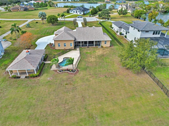 birds eye view of property with a water view