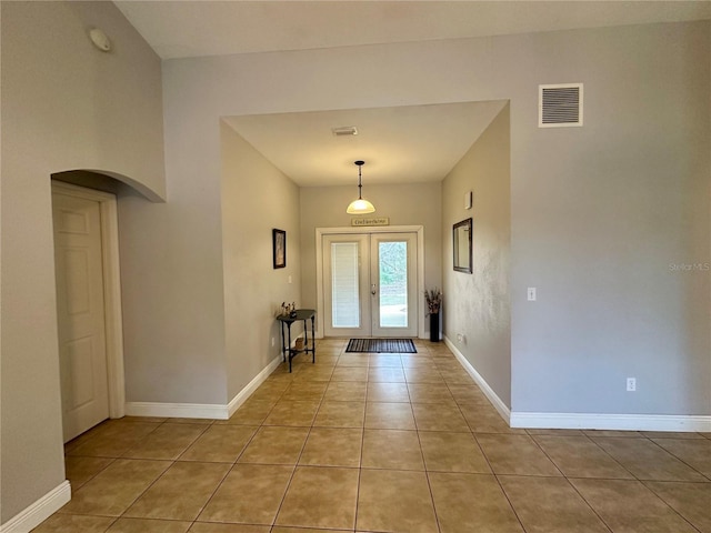 tiled entryway with french doors