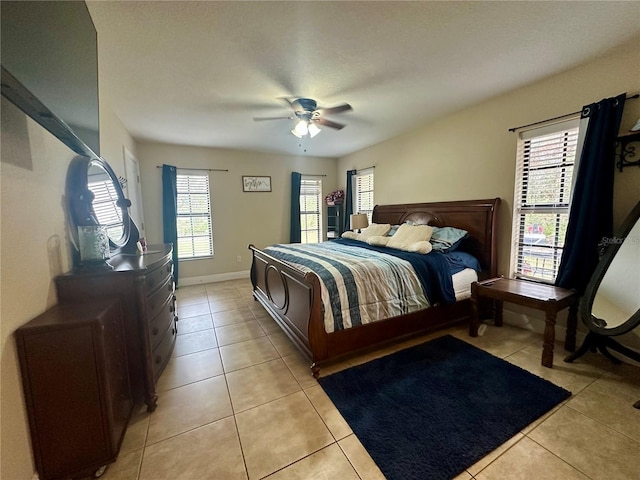 bedroom featuring ceiling fan and light tile patterned floors