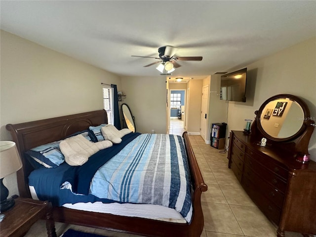 bedroom featuring ceiling fan and light tile patterned flooring