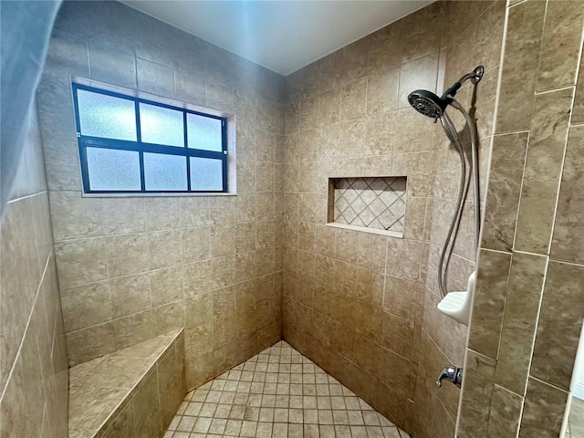 bathroom with tiled shower