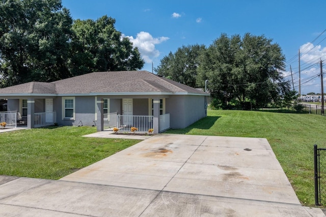 ranch-style house with covered porch and a front lawn