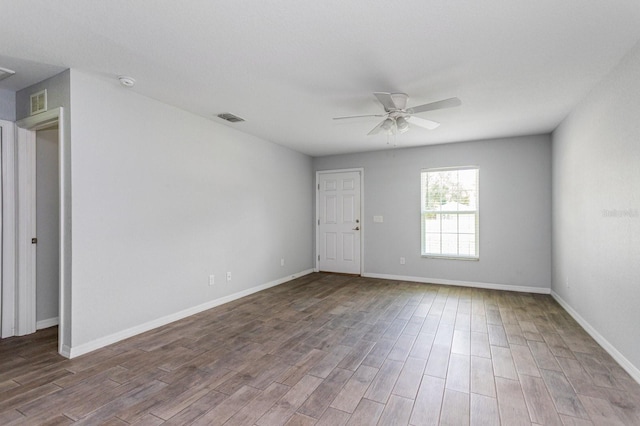 unfurnished room featuring hardwood / wood-style flooring and ceiling fan