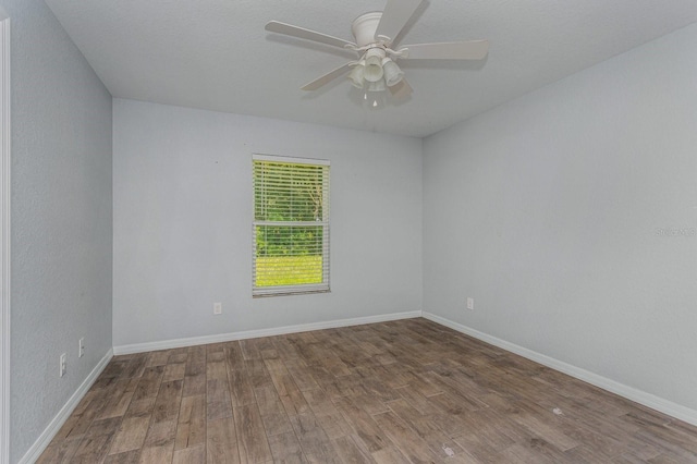 unfurnished room featuring hardwood / wood-style floors and ceiling fan