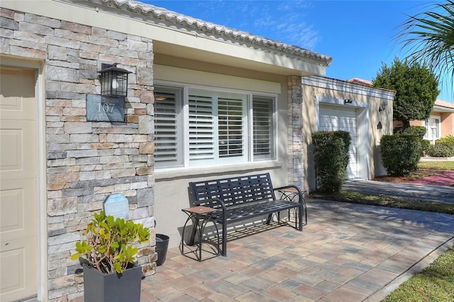 view of patio featuring a garage