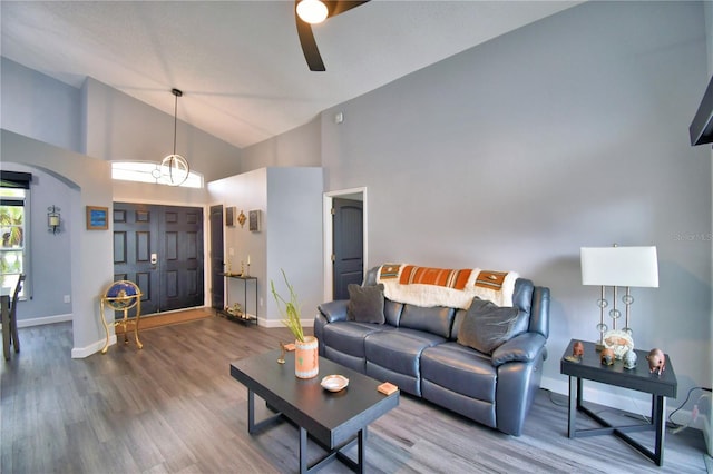 living room featuring hardwood / wood-style floors and high vaulted ceiling