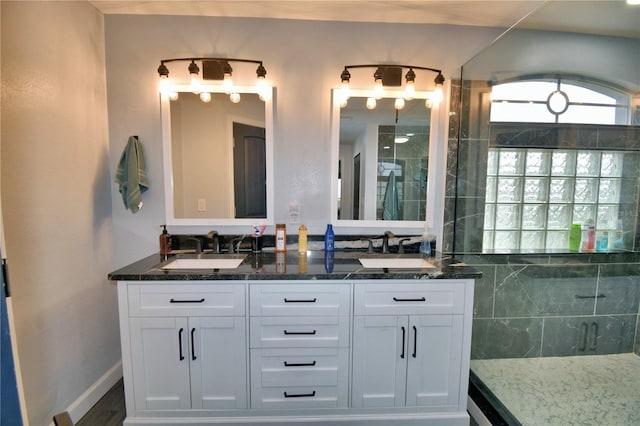 bathroom with vanity and wood-type flooring