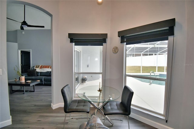 dining space featuring ceiling fan and wood-type flooring