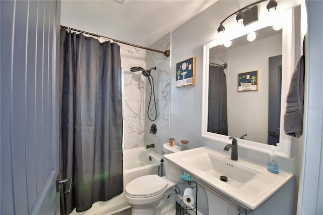 full bathroom with shower / bathtub combination with curtain, sink, and toilet