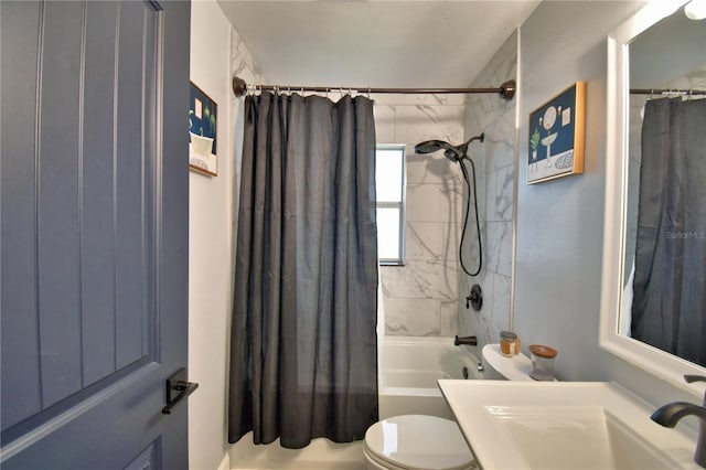 full bathroom featuring toilet, shower / bathtub combination with curtain, and sink