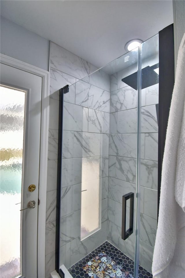 bathroom with plenty of natural light and an enclosed shower