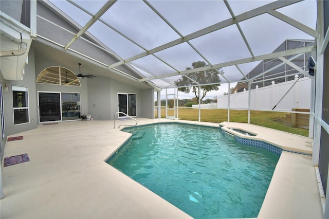 view of pool featuring a hot tub, a lanai, ceiling fan, and a patio area