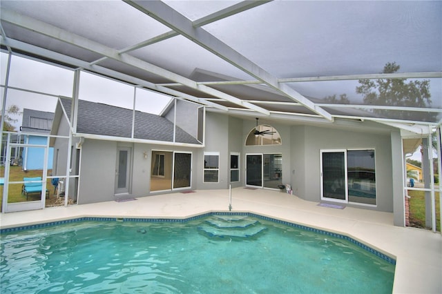 view of pool featuring a patio area and glass enclosure