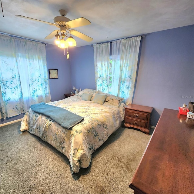 bedroom featuring ceiling fan and carpet flooring