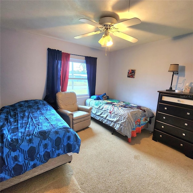 bedroom with ceiling fan and carpet flooring