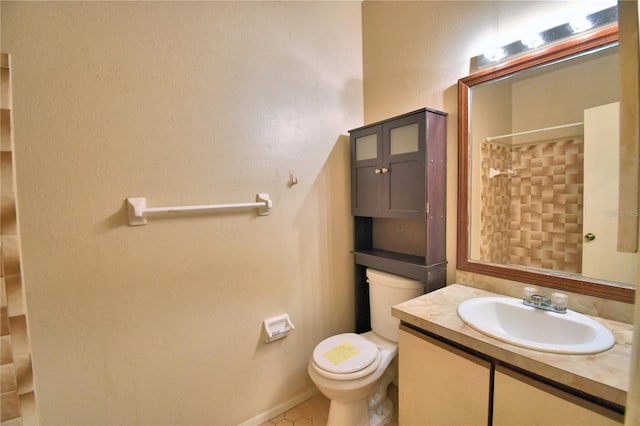 bathroom with vanity, curtained shower, tile patterned floors, and toilet