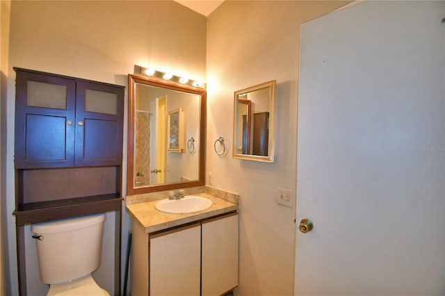 bathroom with vanity and toilet