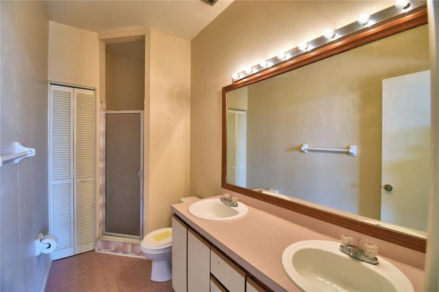 bathroom featuring vanity, an enclosed shower, tile patterned floors, and toilet