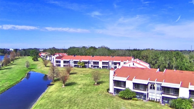 birds eye view of property with a water view