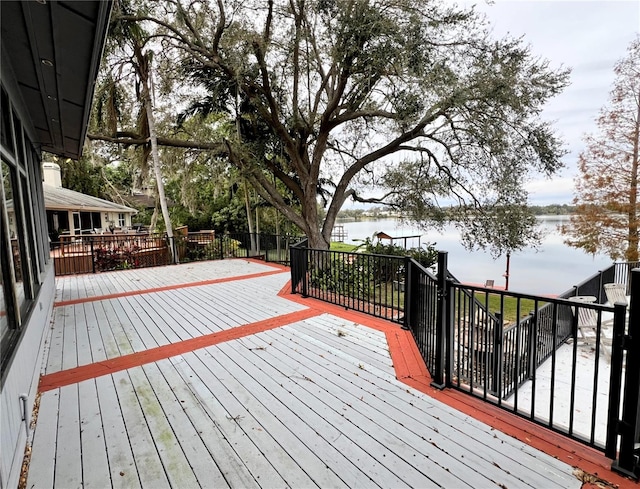 wooden deck featuring a water view