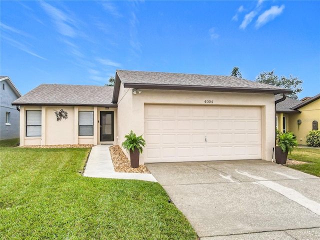 single story home with a garage and a front yard