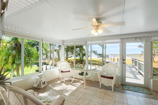 sunroom / solarium featuring ceiling fan