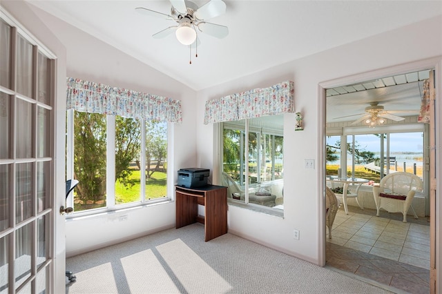 sunroom with ceiling fan, lofted ceiling, and a wealth of natural light