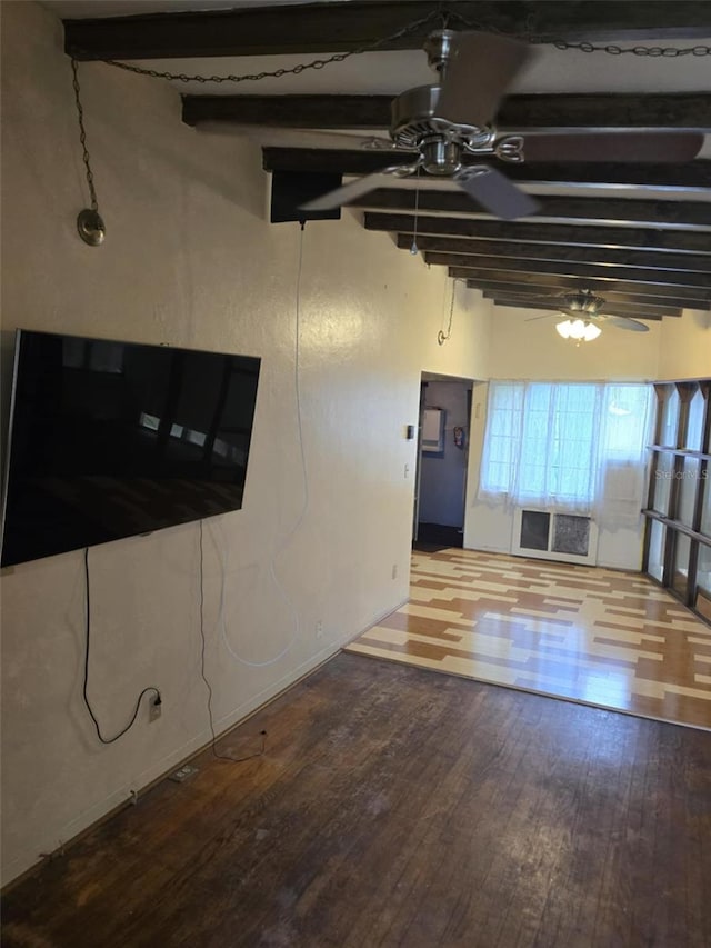 interior space featuring ceiling fan, hardwood / wood-style flooring, and beamed ceiling