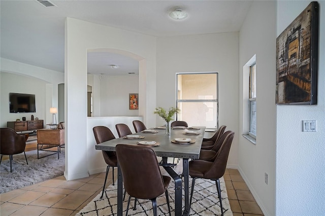 dining area featuring light tile patterned floors