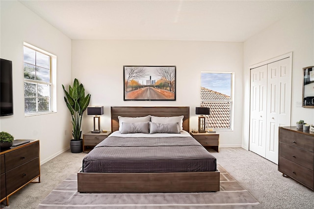 carpeted bedroom with a closet