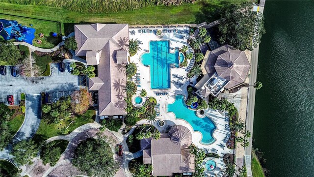 birds eye view of property with a water view