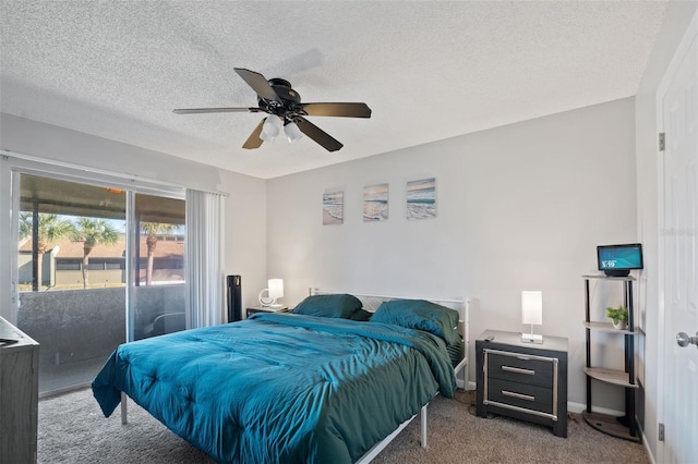 bedroom featuring a textured ceiling, carpet floors, and ceiling fan