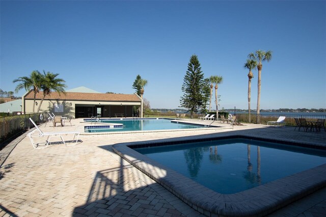 view of swimming pool with a patio area