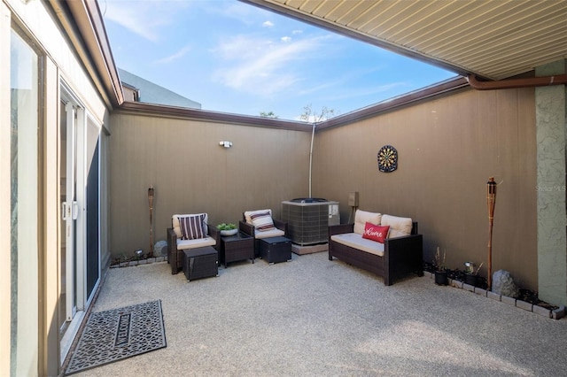 view of patio / terrace with an outdoor living space and central AC