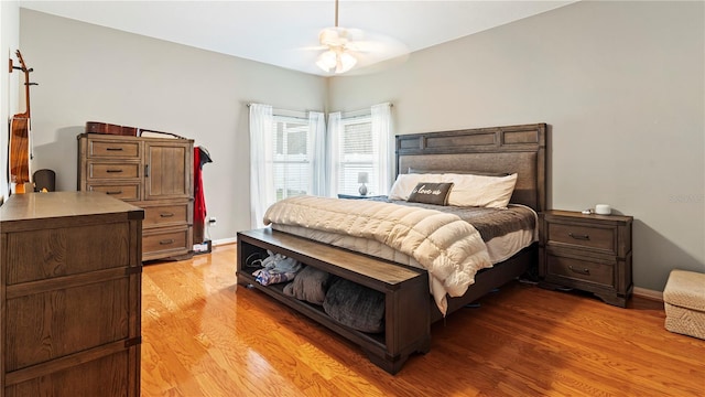 bedroom with ceiling fan and light wood-type flooring