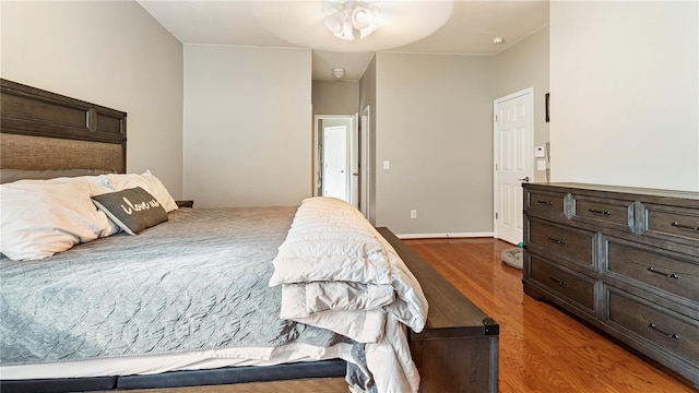 bedroom with hardwood / wood-style floors