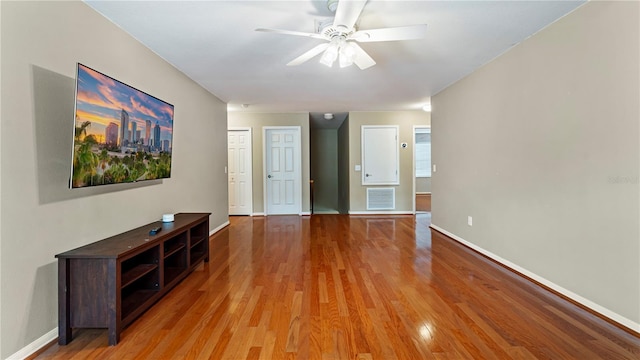 unfurnished living room with ceiling fan and light wood-type flooring