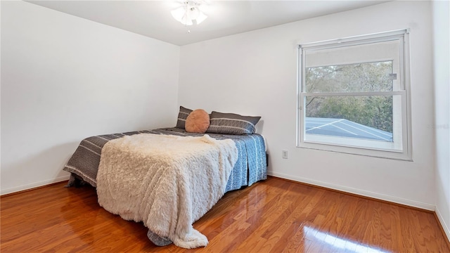 bedroom with wood-type flooring