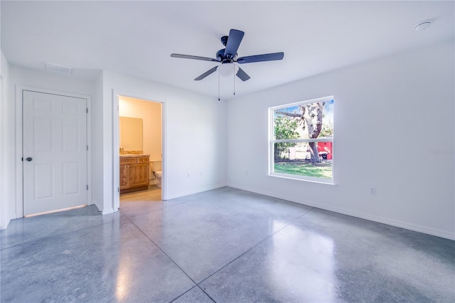 unfurnished bedroom with ceiling fan and ensuite bath