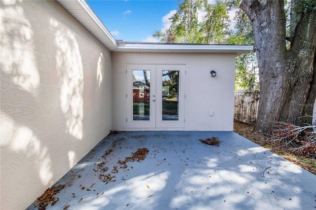 entrance to property with french doors and a patio