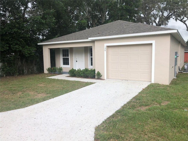 124 A St, Haines City, FL 33844 - single story home with stucco siding, concrete driveway, roof with shingles, and a front lawn