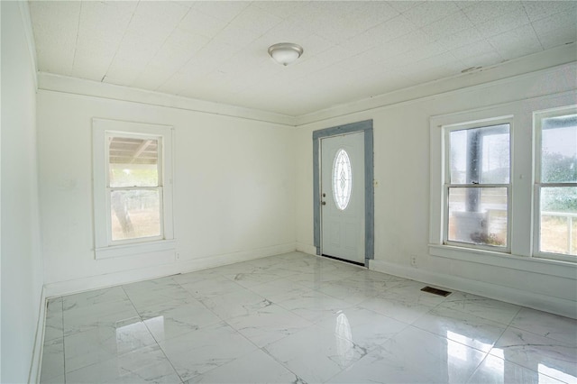 entrance foyer featuring crown molding